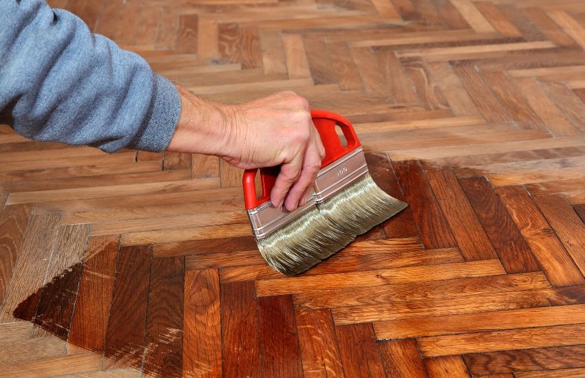Remove Loose Soil By Sweeping Laminate Parquet Flooring