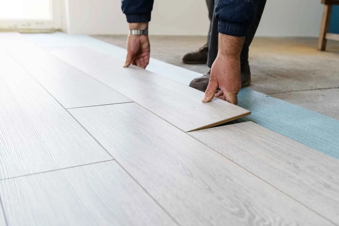 Flooring Dubai Team member installing lvt flooring