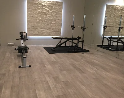 Luxury vinyl tiles install in personal gym